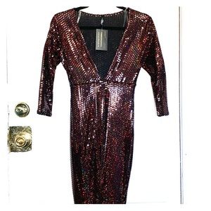 Double slit shiny burgundy dress.